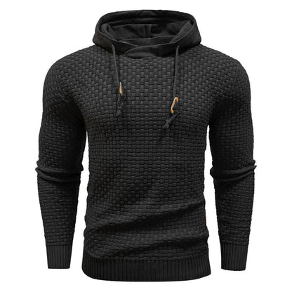 Zwarte hoodie, close-up van de geribbelde manchetten en zoom, bewijst de slijtvastheid.