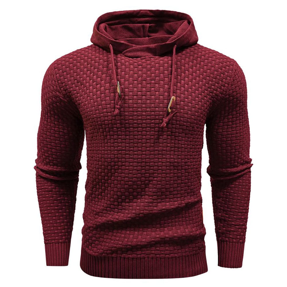 Rode hoodie, van bovenaf gefotografeerd, toont de ruime snit en het comfortabele volume.