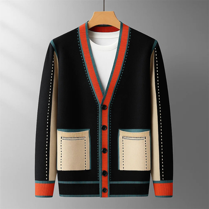 Close-up van de Casimir cardigan in zwart, toont de fijne wolblendtextuur en contrasterende biezen op de kraag.