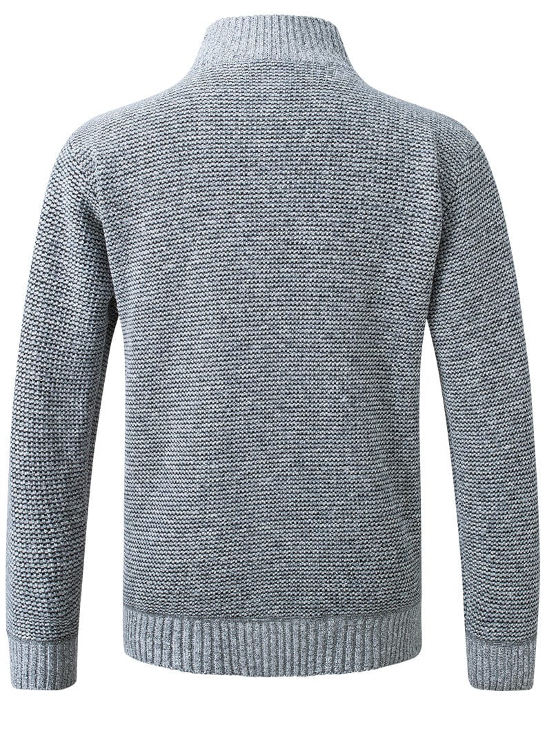Close-up van het verstelbare trekkoord in de taille van de zwarte jas, met aandacht voor de afwerking.
