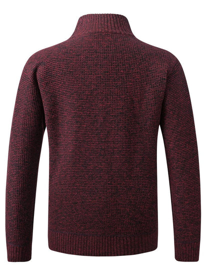 De Seppe jas in burgundy, plat gelegd, waarbij de cropped lengte en het slanke silhouet goed uitkomen.