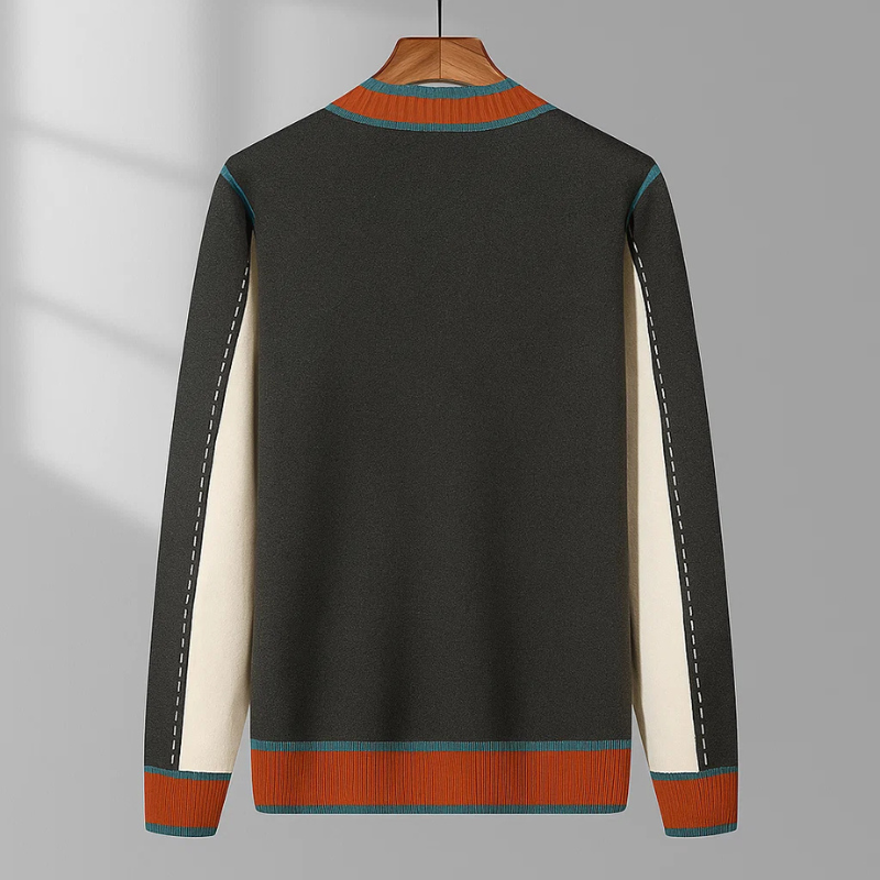 Zijaanzicht van de grijze Casimir cardigan, die de comfortabele pasvorm en de geribbelde manchetten duidelijk weergeeft.