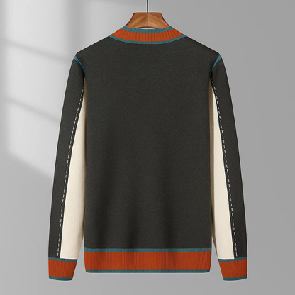 Zijaanzicht van de grijze Casimir cardigan, die de comfortabele pasvorm en de geribbelde manchetten duidelijk weergeeft.