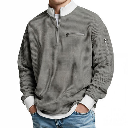 Stapel van diverse kleuren van de comfortabele wafelgebreide herentrui, perfect voor elke garderobe.