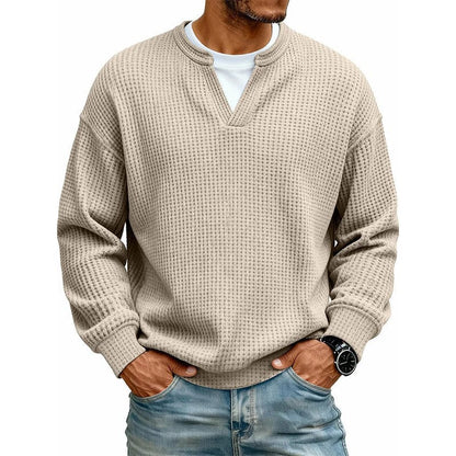 De Merijn wafelgebreide trui in een lichte, frisse kleur, op een platte ondergrond, met alle kleuropties gesorteerd.