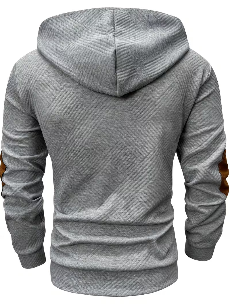 Detailopname van de capuchon met trekkoord van de marineblauwe Jesper gestructureerde hoodie, klaar voor koudere dagen.
