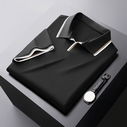 Stofdetail van het groene poloshirt, toont de 230 GSM kwaliteit van de katoenblend.