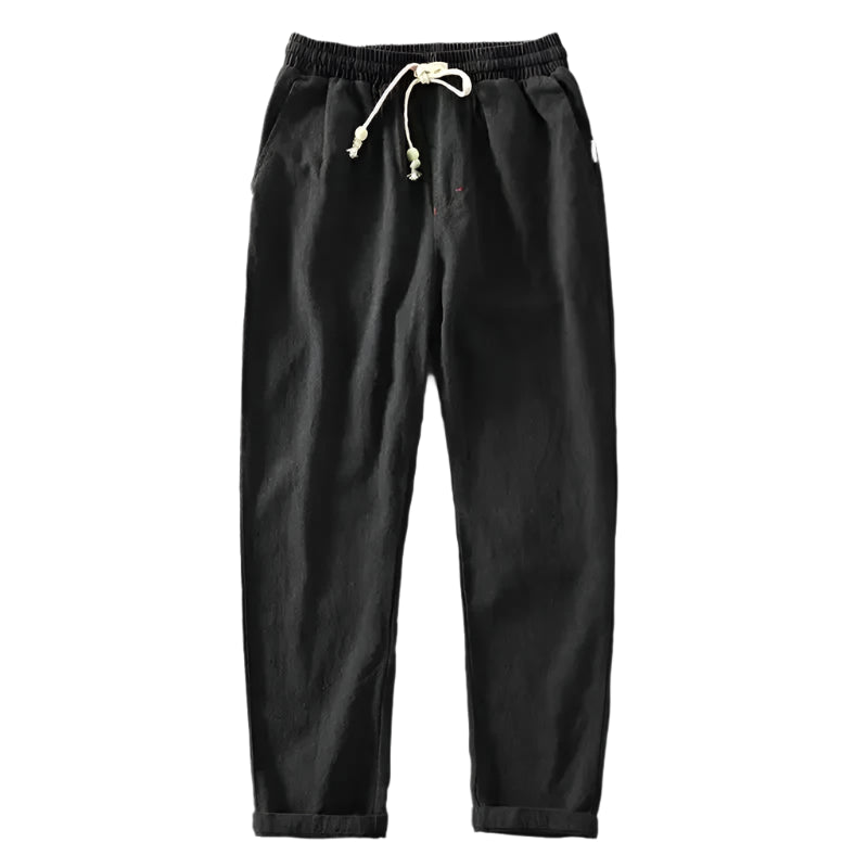 Zijaanzicht van de lichtgrijze linnen trousers, met focus op de moderne pasvorm en comfortabele snit.