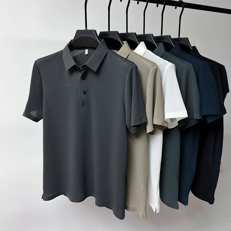 Detail van de mouw en zoom van het Jorin herenpoloshirt in Küsten Blau, afwerking