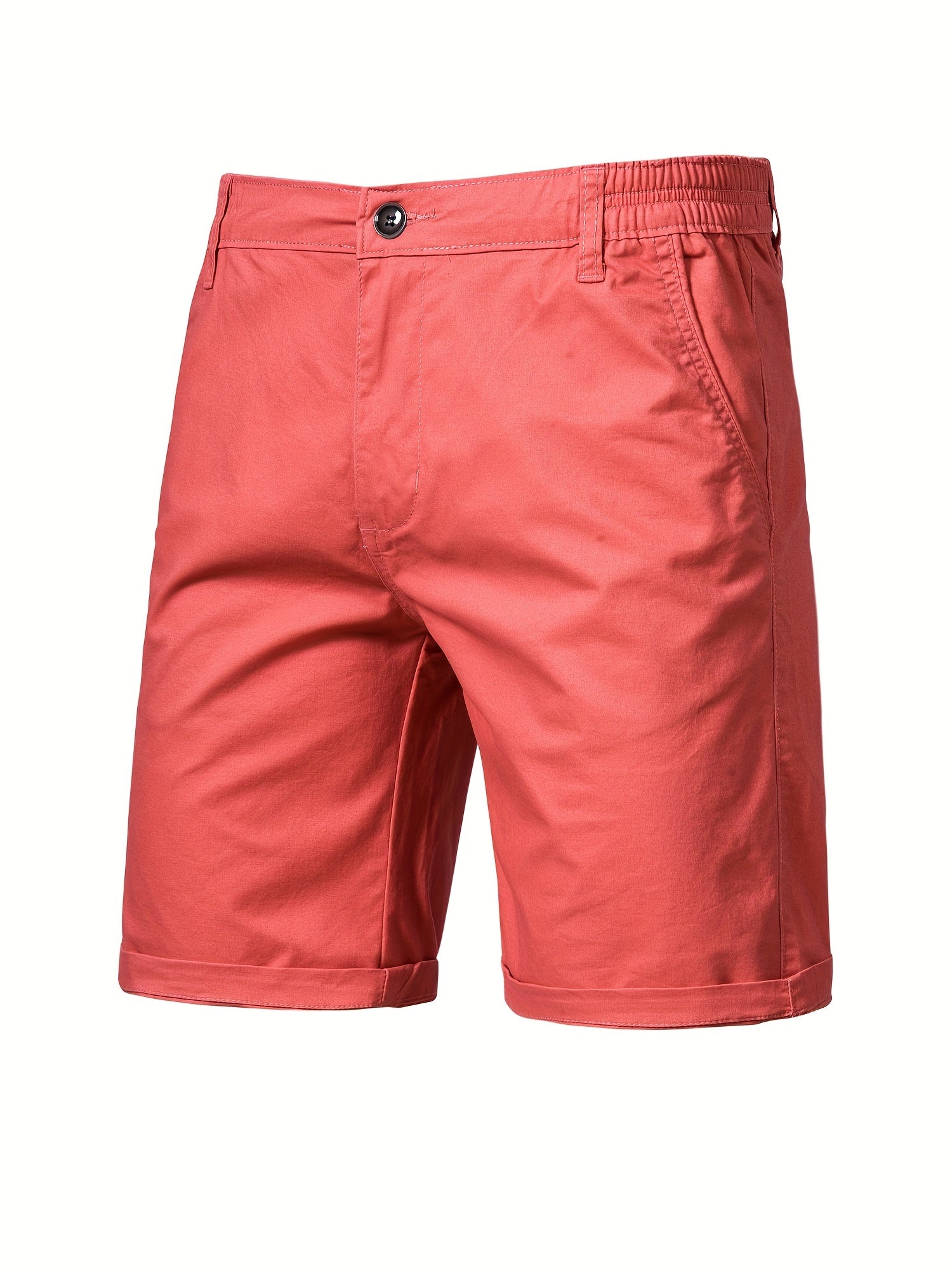Model draagt roze katoenen shorts, lopend, dynamische pose.