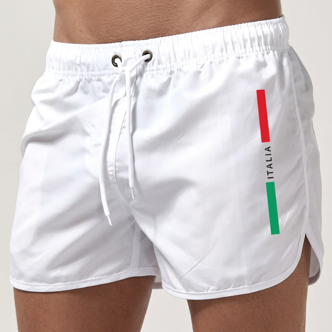 De Otis zwemshort in klassiek zwart, liggend op een lichte ondergrond, toont het sneldrogende materiaal.