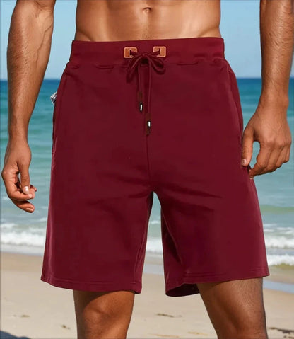 Quinn sportieve shorts in het zwart, liggend plat, met de focus op de nette afwerking en het veelzijdige ontwerp.