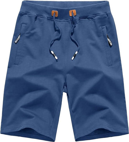Gestapelde Quinn shorts in verschillende kleuren: marineblauw, blauw, tropisch blauw, rood en groen, op een lichte achtergrond.