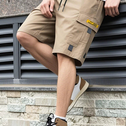 Stapel van de Reuben heren cargoshorts in alle beschikbare kleuren (grijs, zwart, khaki, army groen, donkerblauw), van bovenaf gezien.