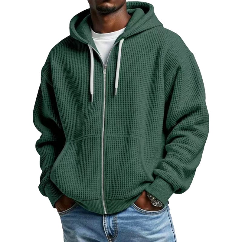 De Gerrit hoodie in paars, netjes opgevouwen op een houten oppervlak, toont de hoogwaardige textuur.