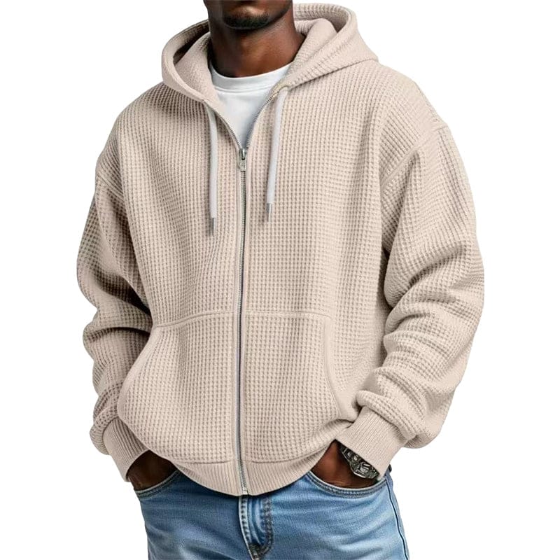 Detail van de geribde manchet en zoom van de rode katoenmix hoodie, wat de afwerking laat zien.