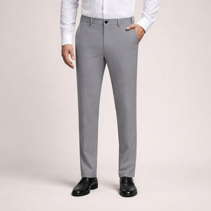 Zijaanzicht van de zwarte Sten Trousers, met de taps toelopende pijp en de slim-fit pasvorm die het moderne silhouet accentueert.